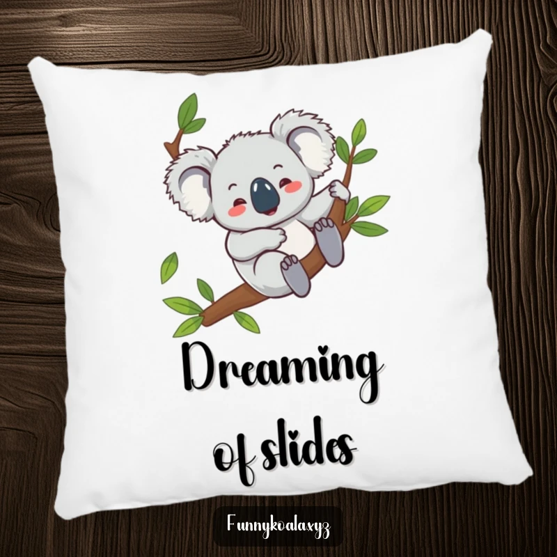 Funny koala pillow featuring a giggling koala character sliding down a eucalyptus branch, offering comfort and a cheerfully humorous accent.